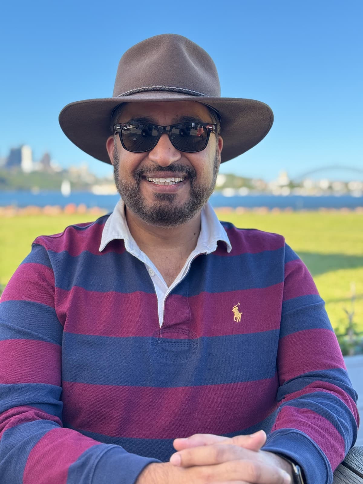 Khalid, founder of WOMBATS Shield, on Sydney Harbour on a clear day.